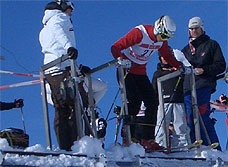 Ski cross participant lines up at the gate