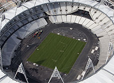 Aerial view of the 2012 London Olympic Stadium with a newly turfed event field.